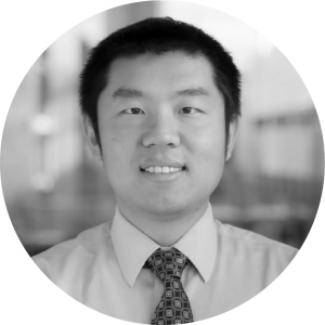 headshot of an Asian man with short black hair