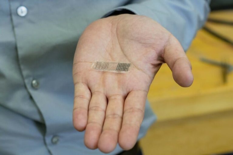 UW–Madison Professor Xudong Wang holds a fracture electrostimulation device he and his lab designed. When placed over a fracture, the device generates electricity from movement, accelerating bone healing.