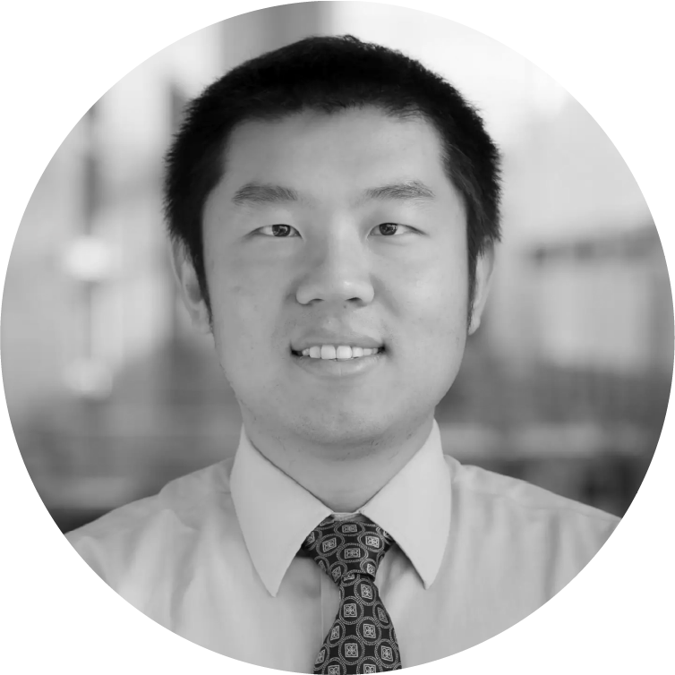 headshot of an Asian man with short black hair