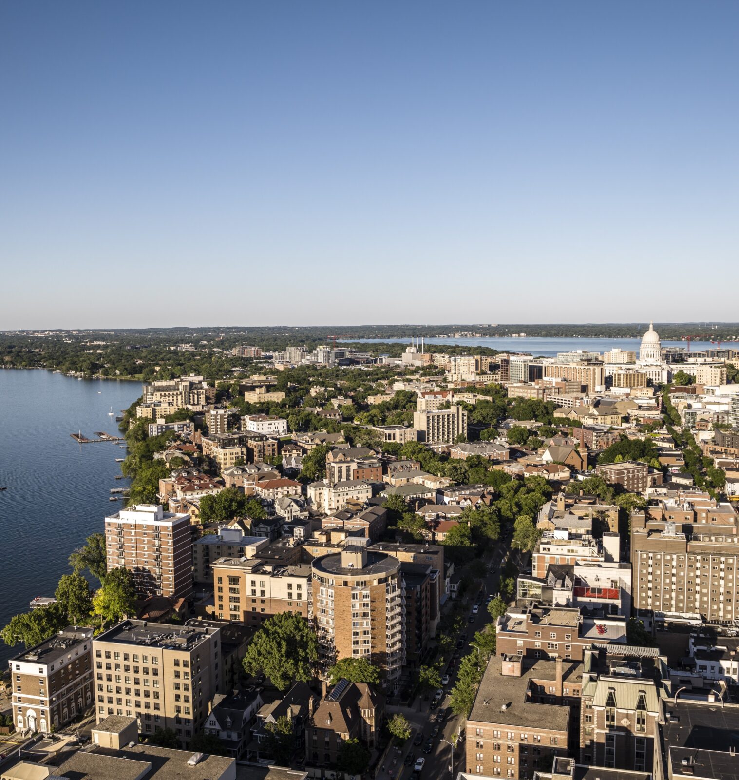 aerial skyline of a city between two lakes