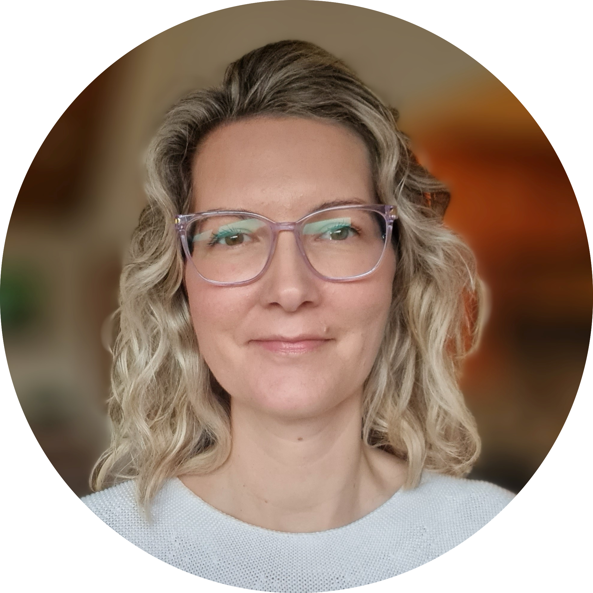 headshot of a white woman with long blond hair and glasses