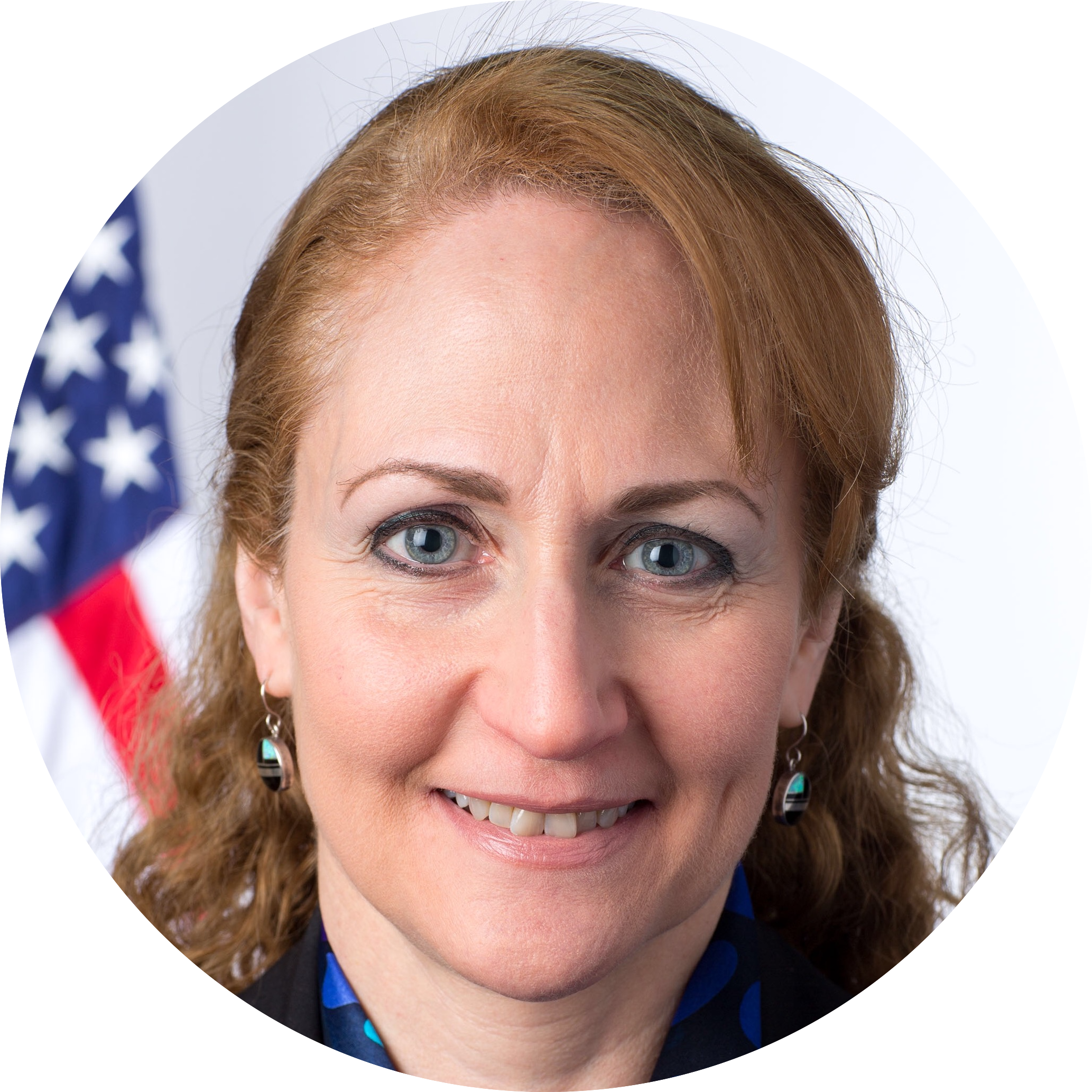 headshot of a white woman with long red hair