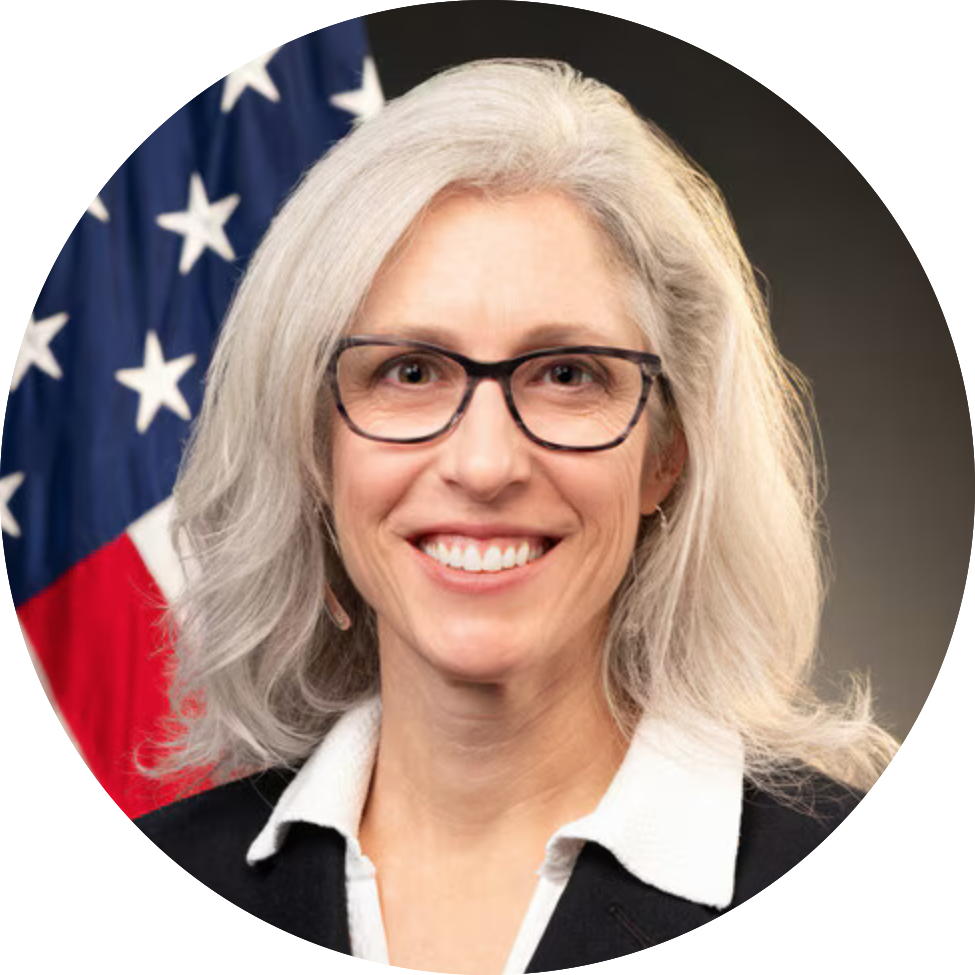 headshot of white woman with light hair and glasses